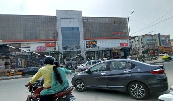 GSM Mall Chandanagar The impressive glass facade of GSM Mall in Chandanagar featuring major retail brands and a multiplex near Prestige Golden Grove in Hyderabad
