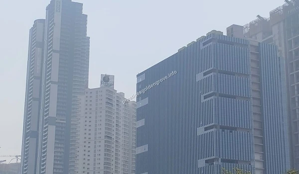 IT Tech Park A wide view of the bustling IT tech park and corporate skyscrapers surrounding the Prestige Golden Grove project