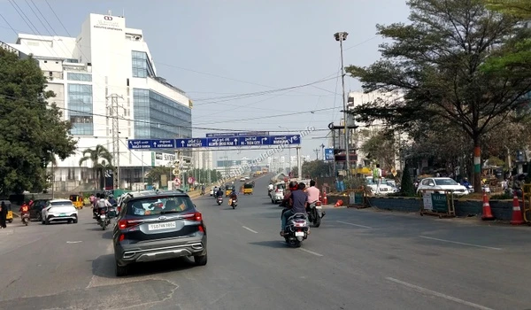 Marriott Hotel Circle Traffic moving through the Marriott Hotel circle area with clear overhead signage towards Hi-Tech City, serving Prestige Golden Grove residents