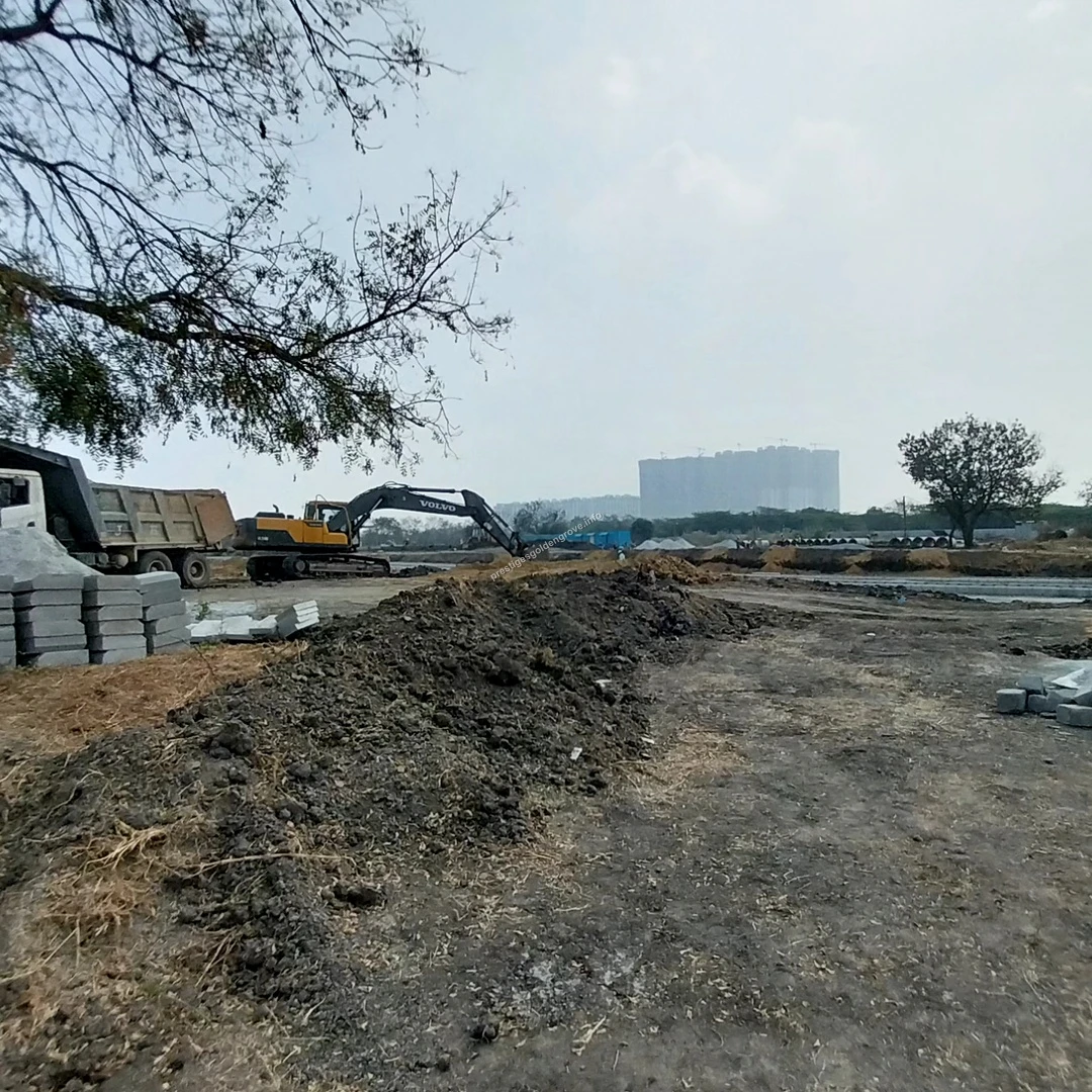 Site Overview Expansive view of the land development and high-rise construction progress at Prestige Golden Grove in Hyderabad