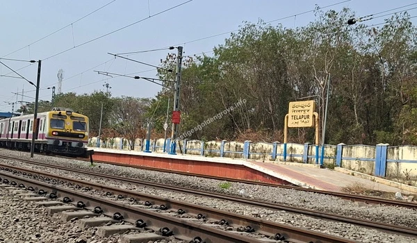 Nearby Railway Station View of the Telapur Railway Station with an arriving local train, highlighting the excellent rail connectivity and daily commuting options available near the Prestige Golden Grove residential project