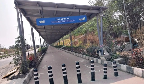 Tellapur Direction Signage Overhead directional signage at the Tellapur Junction cycling track highlighting the route to Narsingi Hub from Prestige Golden Grove